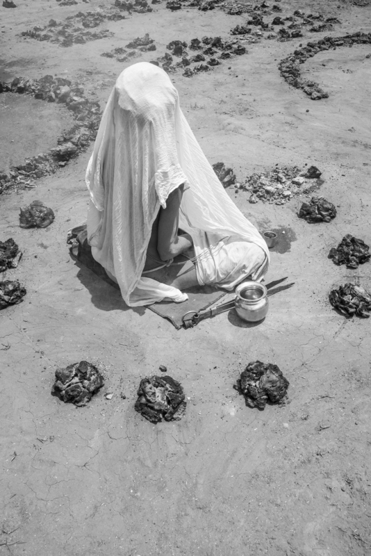 Gopal Dāsa Mahātyāgī performing dhūnī-tap. This photograph was taken by Prema Goet during the Kumbha Mela in Ujjain, India, in 2015/2016, and printed at Fotoleutner in Vienna in 2026. It was acquired by Task Force 3 of the MANTRAMS project as part of Goet’s doctoral research at the University of Vienna. Between 2025 and 2028, the photograph was exhibited within the exhibition “Dhun / Dhūnī.The Fires of the Name,” presented during the Yoga Darśana Conference “Yoga Darśana, Yoga Sādhana: Authenticity, Authority, and Adaptation” in Paris, as well as in an exhibition at the Department of South Asian, Buddhist and Tibetan Studies at the University of Vienna in 2026.