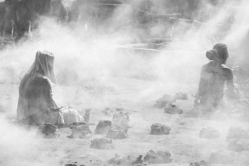 A group of Rāmānandī ascetics performing dhūnī-tap. This photograph was taken by Prema Goet during the Kumbha Mela in Ujjain, India, in 2016, and printed at Fotoleutner in Vienna in 2026. It was acquired by Task Force 3 of the MANTRAMS project as part of Goet’s doctoral research at the University of Vienna. Between 2025 and 2028, the photograph was exhibited within the exhibition “Dhun / Dhūnī.The Fires of the Name,” presented during the Yoga Darśana Conference “Yoga Darśana, Yoga Sādhana: Authenticity, Authority, and Adaptation” in Paris, as well as in an exhibition at the Department of South Asian, Buddhist and Tibetan Studies at the University of Vienna in 2026.